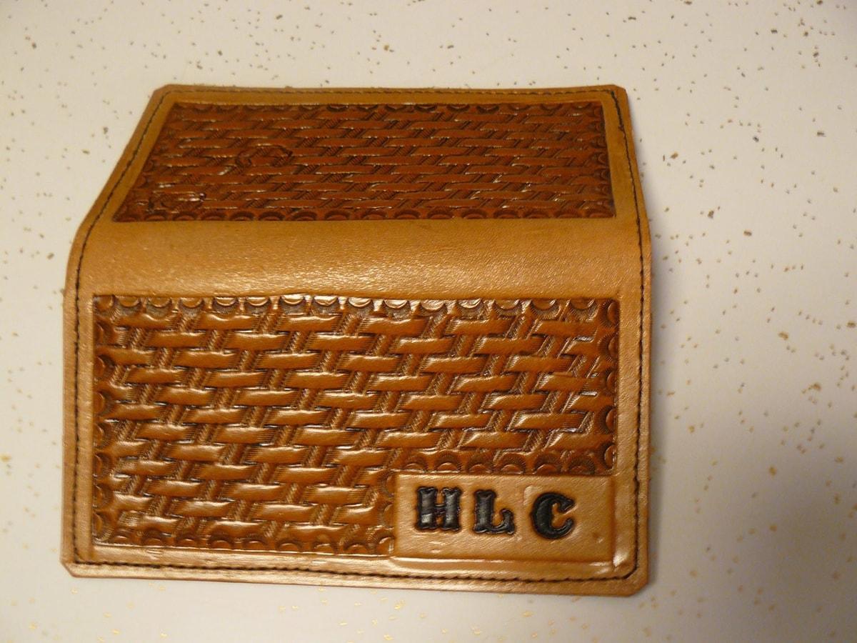 Tan leather wallet with basketweave panels and HLC initials